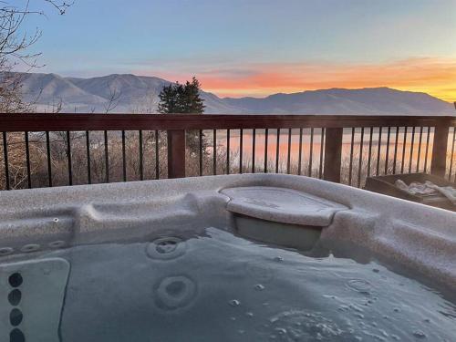 a bath tub with a view of the mountains at Snowbasin + Powder Mountain + Spa + Eden in Eden