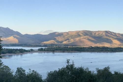 a large body of water with mountains in the background at Snowbasin + Powder Mountain + Spa + Eden in Eden