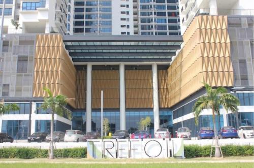 a redo sign in front of a building with palm trees at 1-5 Pax Comfy Trefoil Studio-Walk to Setia City Mall & Setia City Convention Centre in Shah Alam
