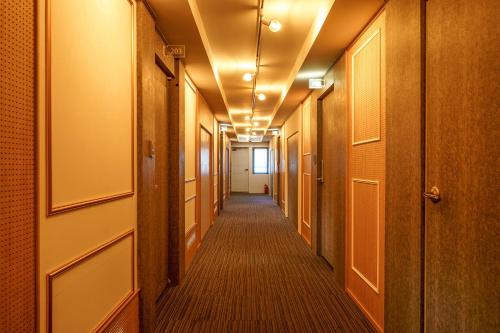 a corridor in an office building with a hallway at Gongju No 25 Hotel in Gongju