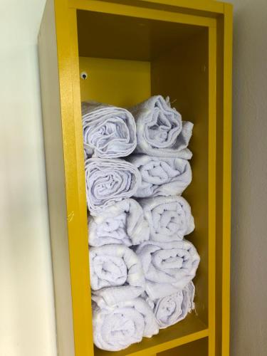 a pile of towels in a bathroom at “Mar doce Lar” in Lauro de Freitas