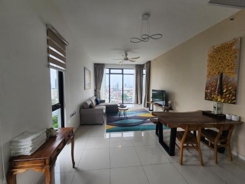 a living room with a table and a couch at Beacon Executive Suites in George Town