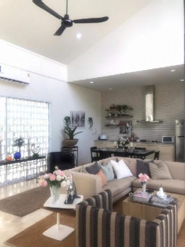 a living room with a couch and a table at THE OAK’S in Chiang Rai