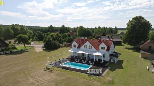an aerial view of a house with a swimming pool at FARIE in Faryny