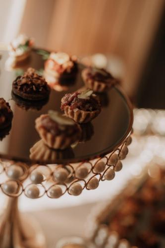 a plate with cupcakes on top of a table at FARIE in Faryny