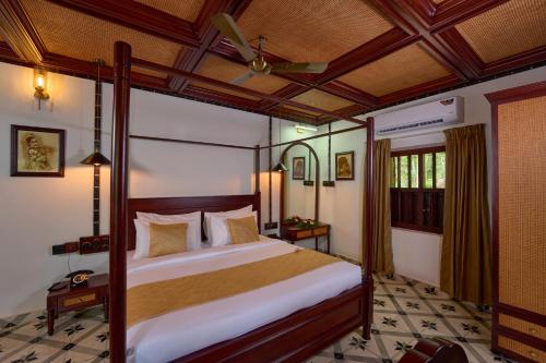 Cama o camas de una habitación en Malabar Kovilakam
