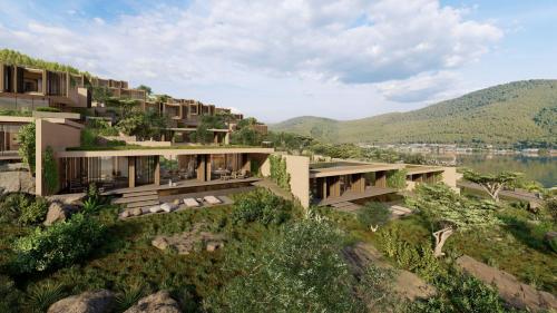 une image d'un bâtiment sur une colline dans l'établissement Lujo Hotel Bodrum, à Guvercinlik