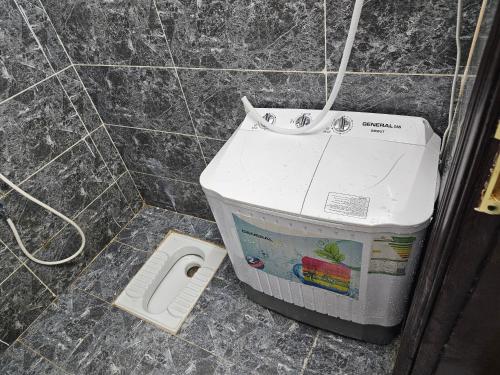 a bathroom with a sink and a toilet in the floor at شقة مفرشة رقم 3 تبعد ٣ كم عن الحرم النبوي الشريف in Al Madinah
