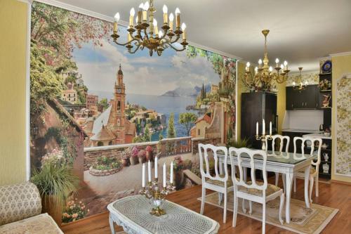 a dining room with a wall mural of a city at Luxury apartment Amalfi 300 m from the beach in Varna City