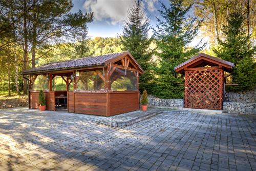a gazebo and a pavilion on a patio at Glamping Pod Gwiazdami Pietrusza Wola in Pietrusza Wola