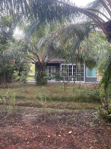 Un jardín fuera de น้ำหราธาราโฮมสเตย์