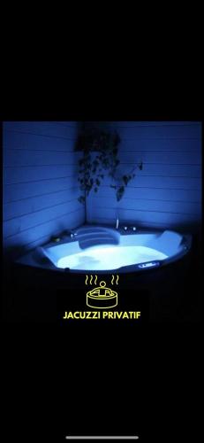 a bath tub with a tree in the middle at Bulle d'R in Dournazac
