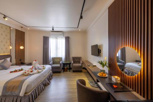 Postel nebo postele na pokoji v ubytování Rosaleen Boutique Hotel