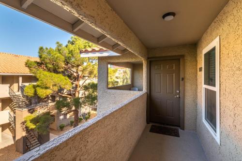 a view from the balcony of a house with a door at Rio-Adjacent 2BR Pool, Gym, Free Parking in Las Vegas