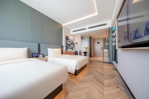 Postel nebo postele na pokoji v ubytování Atour S Hotel Jinan Shunhe