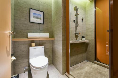 a bathroom with a toilet and a sink at Atour Hotel Beijing Wangjing 798 Art District in Beijing