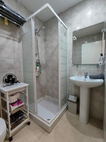 a bathroom with a shower and a sink at Spacious and luxurious apartment in Mojácar