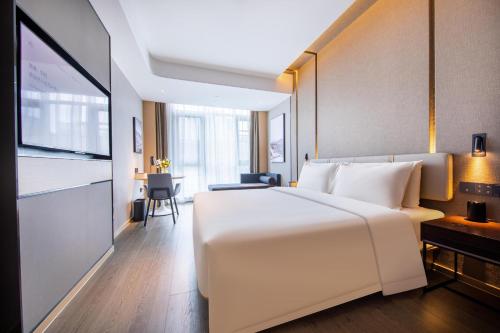 Cama o camas de una habitación en Atour Hotel Nanjing Qidi Street Qinlin Science and Technology Park