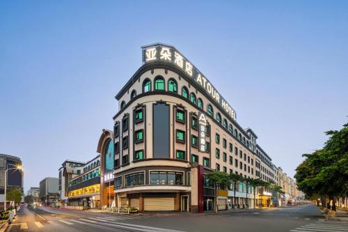a large building on a city street with a street at Atour Hotel Quanzhou Jinjiang Sunshine Plaza in Jinjiang