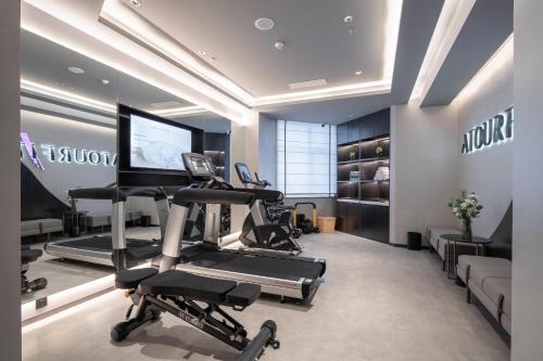 a fitness room with a treadmill and a gym at Atour Hotel Shenyang Zhongshan Plaza in Shenyang