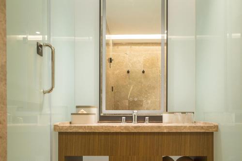 a bathroom with a sink and a shower at Atour X Hotel Dongguan Chang'an Wanda in Dongguan