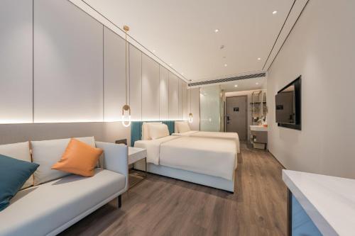 Giường trong phòng chung tại Atour X hotel Shanghai Wujiaochang INNO Chuangzhi
