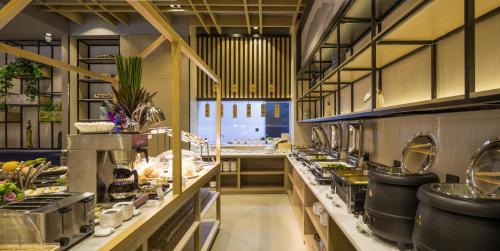 a large kitchen with a bunch of food on the counters at Atour Hotel Hangzhou Xiaoshan Peoples Square in Hangzhou
