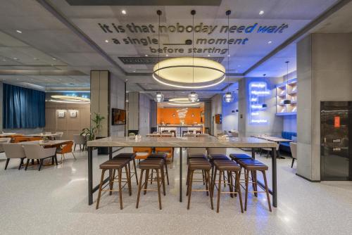 a large dining room with a large table and chairs at Atour S Hotel Beijing Shangdi Qinghe High Speed Railway Station in Beijing