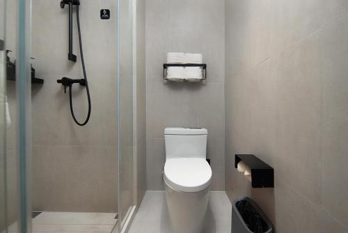 a bathroom with a shower and a toilet in it at Atour Light Hotel Changsha IFC Huangxing Road Pedestrian Street in Changsha
