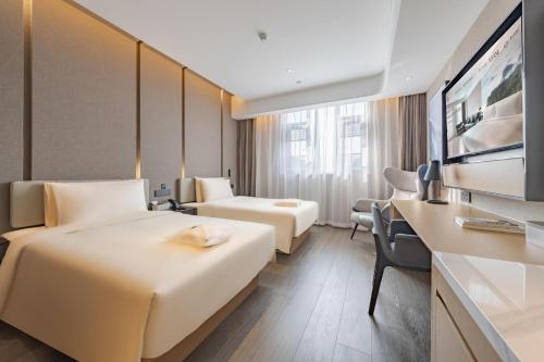 Katil atau katil-katil dalam bilik di Atour Hotel Shanghai Pudong Airport Chuansha Station
