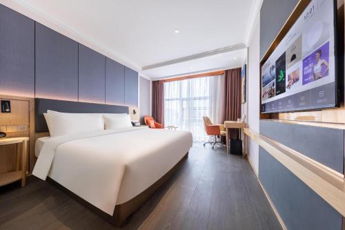 Ένα ή περισσότερα κρεβάτια σε δωμάτιο στο Atour X Hotel Shenzhen Guanlan Shanshui Pastoral