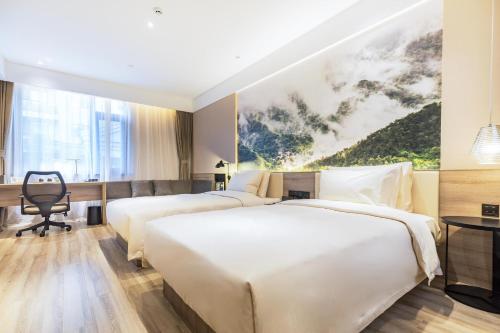 Postel nebo postele na pokoji v ubytování Atour Hotel Jinan Zhangqiu Century Avenue