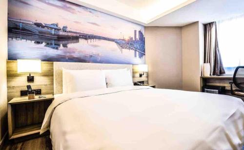 Postel nebo postele na pokoji v ubytování Atour Hotel Dalian Zhongshan Square