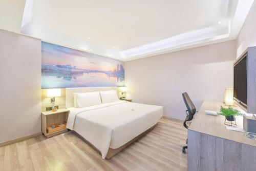 Postel nebo postele na pokoji v ubytování Atour Hotel Dalian Zhongshan Square