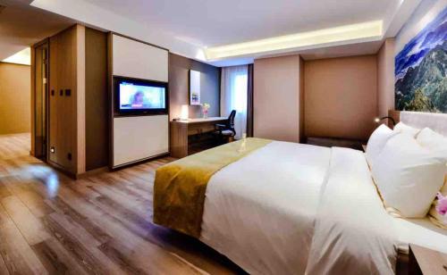 Postel nebo postele na pokoji v ubytování Atour Hotel Dalian Zhongshan Square
