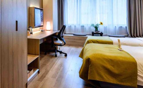 Postel nebo postele na pokoji v ubytování Atour Hotel Dalian Zhongshan Square