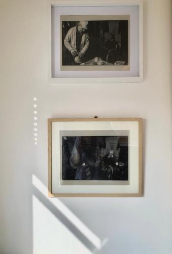 two framed photographs on a wall in a room at Cosy Cabins without hot tub - Greenway Farm, Drybrook, Forest of Dean in Drybrook
