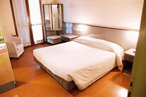 Lova arba lovos apgyvendinimo įstaigoje Hotel Franciacorta