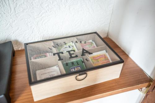 a box of books sitting on a wooden table at #914 Home - Irpinia in Nusco