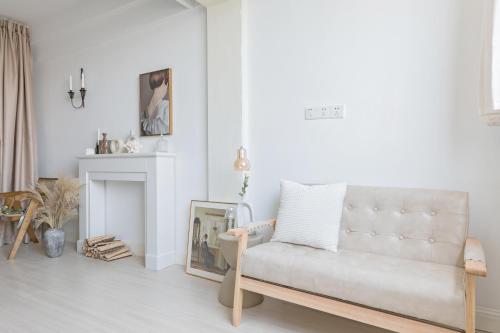 a living room with a couch and a fireplace at Chongqing Forest Design B&B in Chongqing