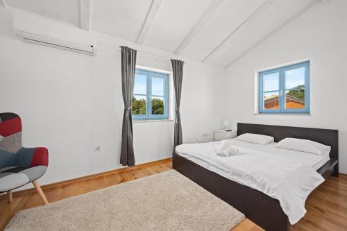 Postel nebo postele na pokoji v ubytování Villas Adagio