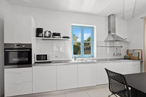 Kuchyň nebo kuchyňský kout v ubytování Villas Adagio