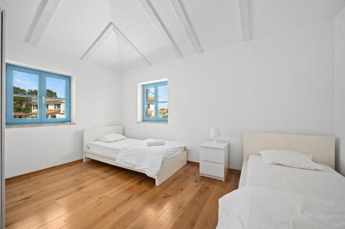 Postel nebo postele na pokoji v ubytování Villas Adagio