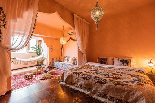 a bedroom with orange walls and a bed and a window at Chongqing Forest Design B&B in Chongqing