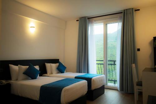 מיטה או מיטות בחדר ב-Single Tree Mount Hotel