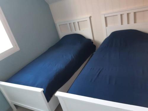 Ένα ή περισσότερα κρεβάτια σε δωμάτιο στο La Ch'tite Cahute
