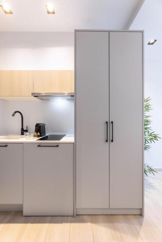 Η κουζίνα ή μικρή κουζίνα στο Amalthia Luxury Suites