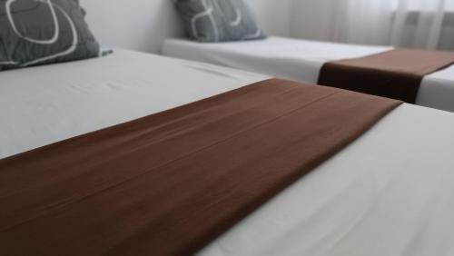 a close up of two beds in a room at Logement Chic, résidence azaléa - Alger in Draria