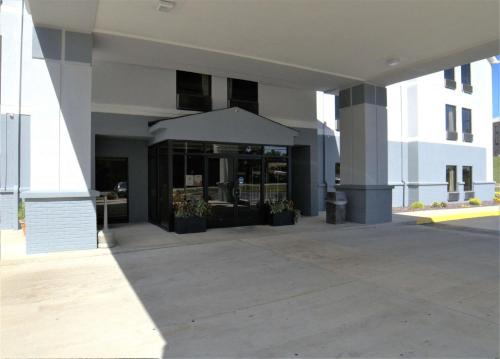 a building with awning in front of a building at Super 8 by Wyndham Crossville TN in Crossville