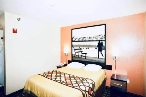 a hotel room with a bed and a view of a bridge at Super 8 by Wyndham Crossville TN in Crossville